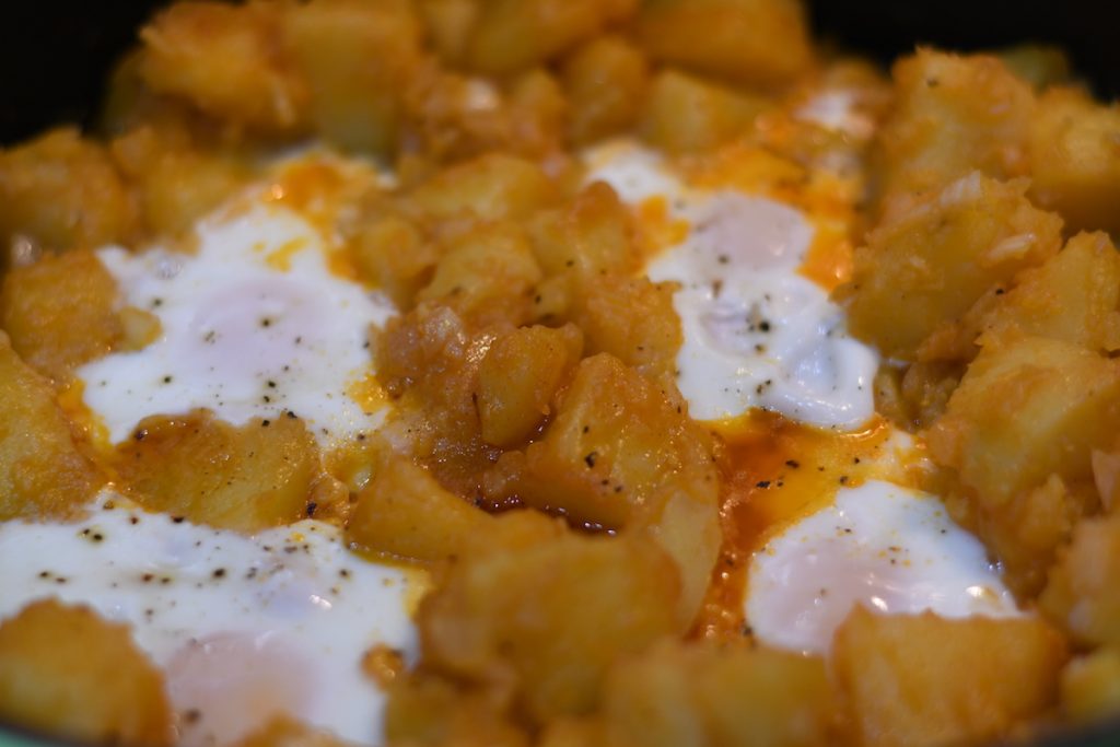 Huevos Rotas is a tapas dish made of potatoes and topped with eggs, that's easy to make.
